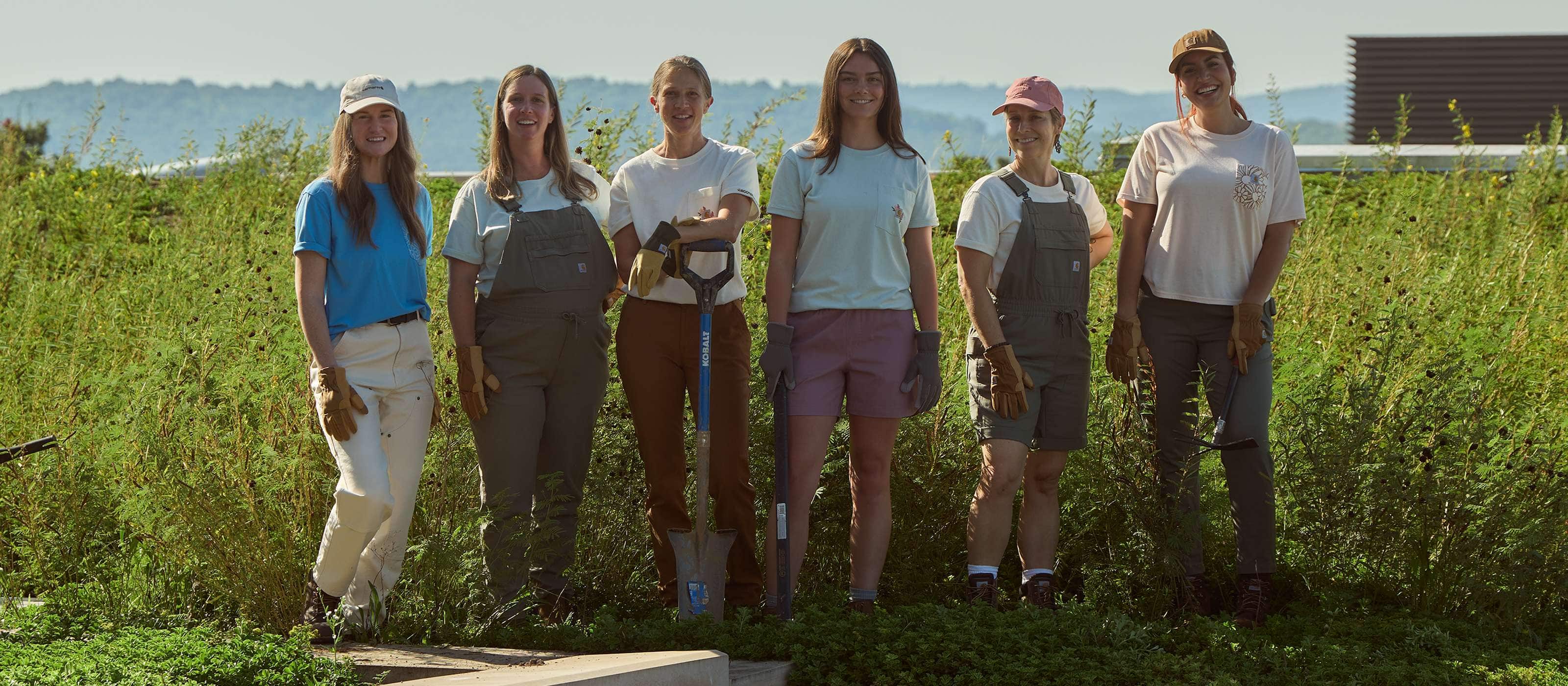 Tradeswomen wearing Carhartt workwear representing women in the trades.