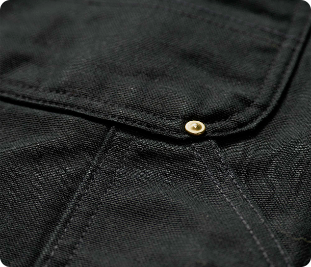 Close-up view of our iconic firm duck material in black highlighting the material's texture