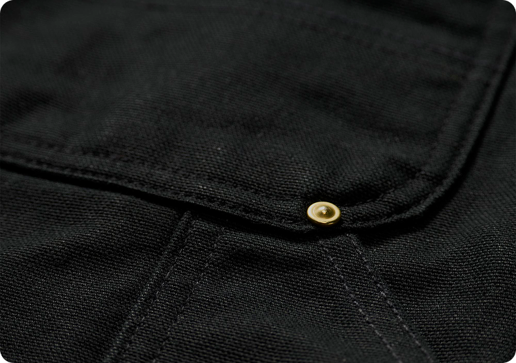 Close-up view of our iconic firm duck material in black highlighting the material's texture