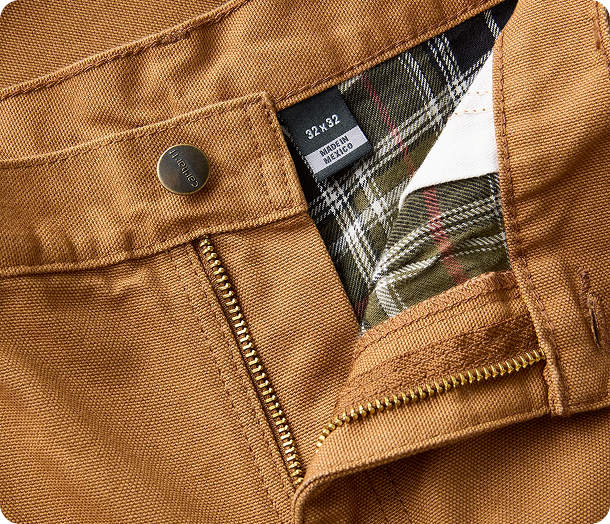 Close-up view of Carhartt washed duck pants material highlighting the texture