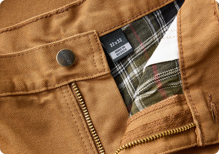 Close-up view of Carhartt washed duck pants material highlighting the texture