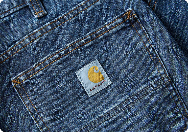 Close-up view of Carhartt denim jeans highlighting the material's texture
