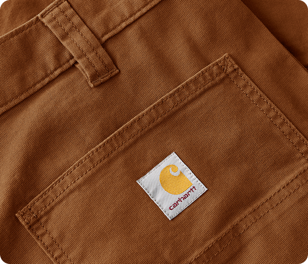 Close-up view of Carhartt canvas pant material highlighting the weave and texture
