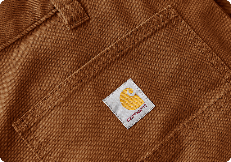 Close-up view of Carhartt canvas pant material highlighting the weave and texture