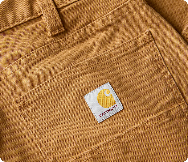 Close-up view of Carhartt Rugged Flex™ duck pant material highlighting the weave and texture