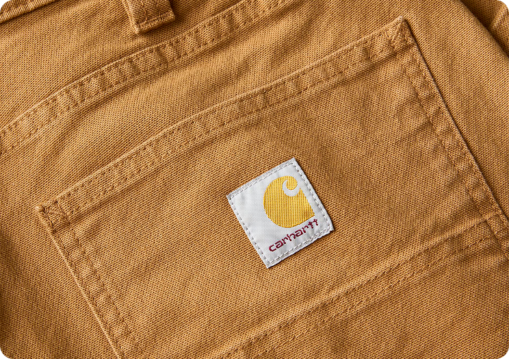 Close-up view of Carhartt Rugged Flex™ duck pant material highlighting the weave and texture
