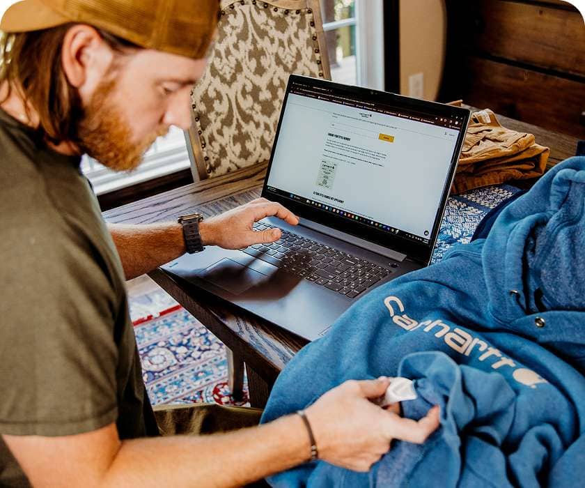 Nick entering his gear's tag info using the online tool on his laptop.