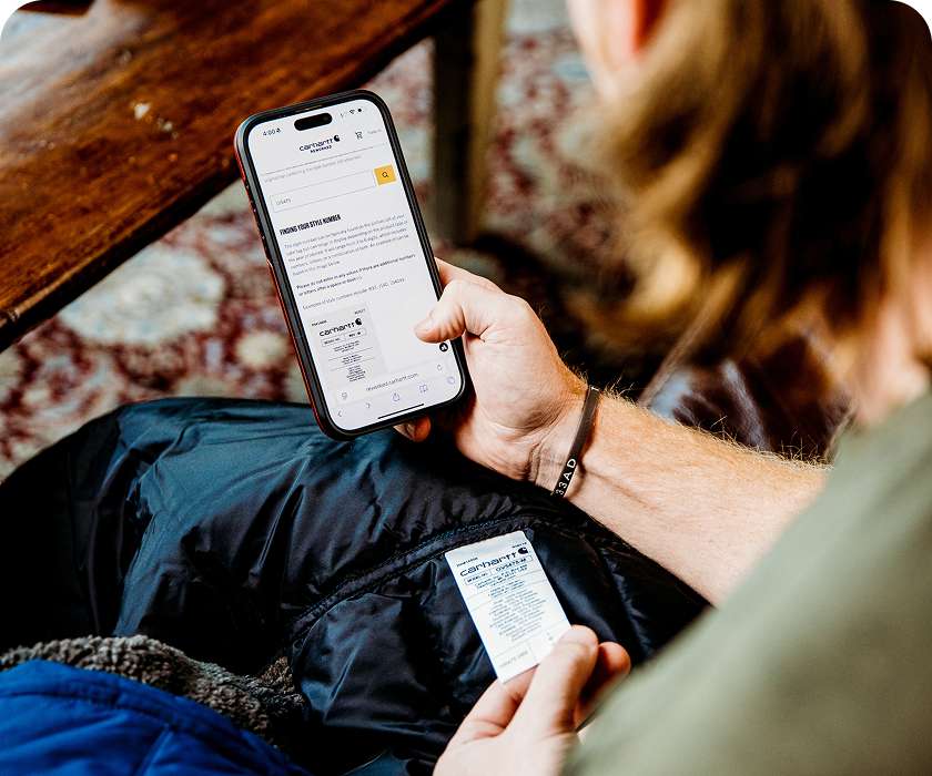 Nick adding tag information from his Carhartt gear to the online trade-in tool using his phone